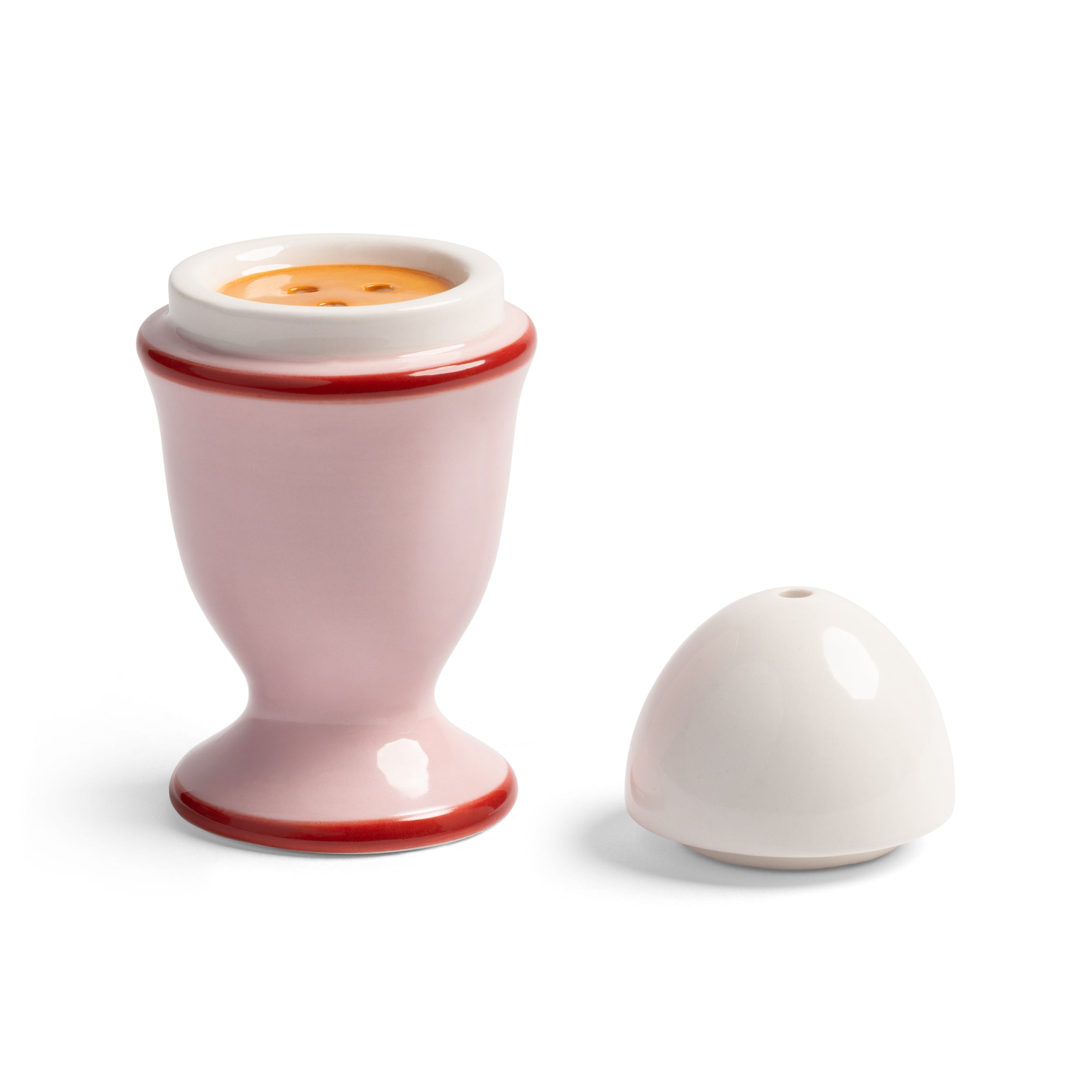 Egg-shaped salt and pepper shakers in pink with red and white