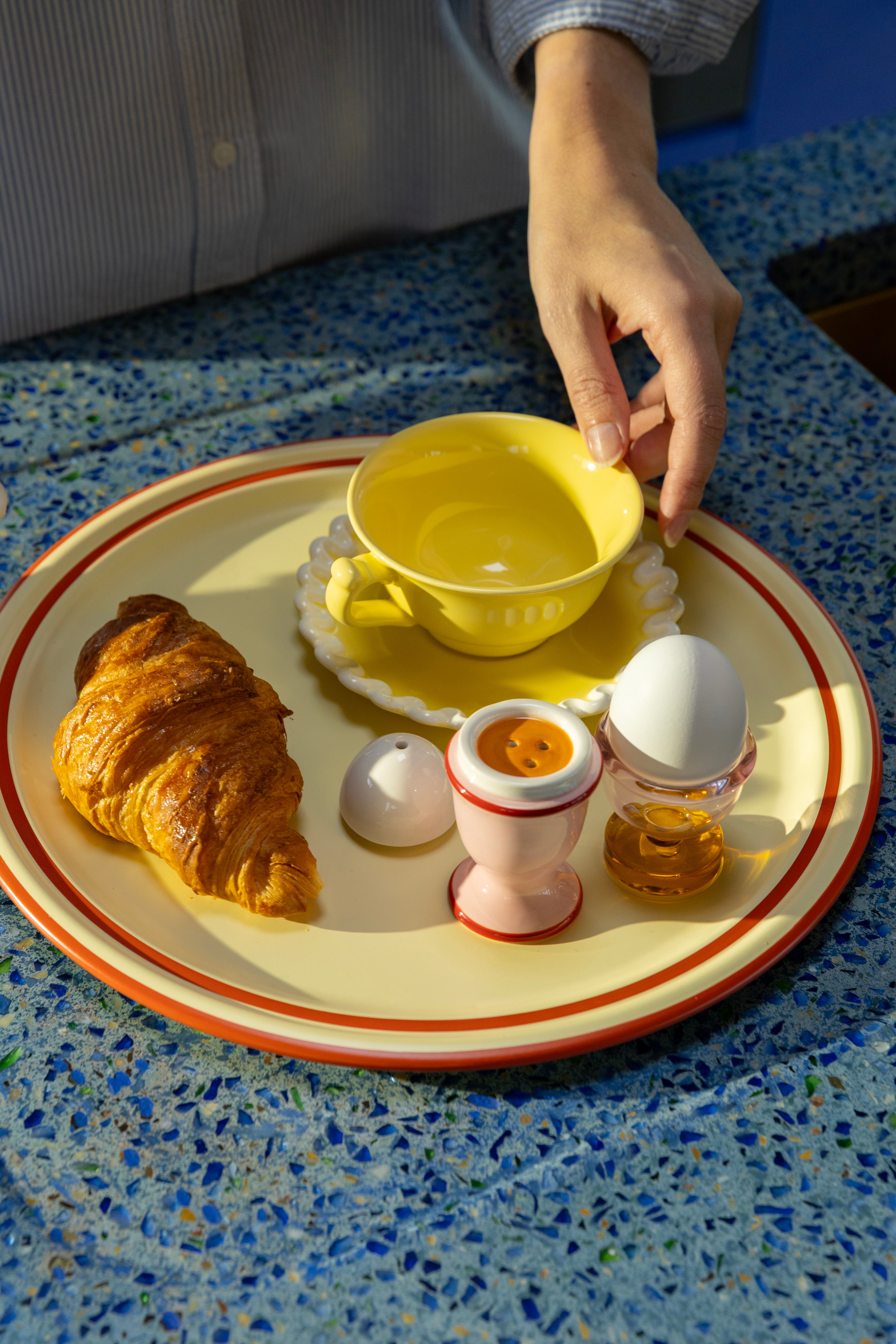 Egg-shaped salt and pepper shakers in pink with red and white