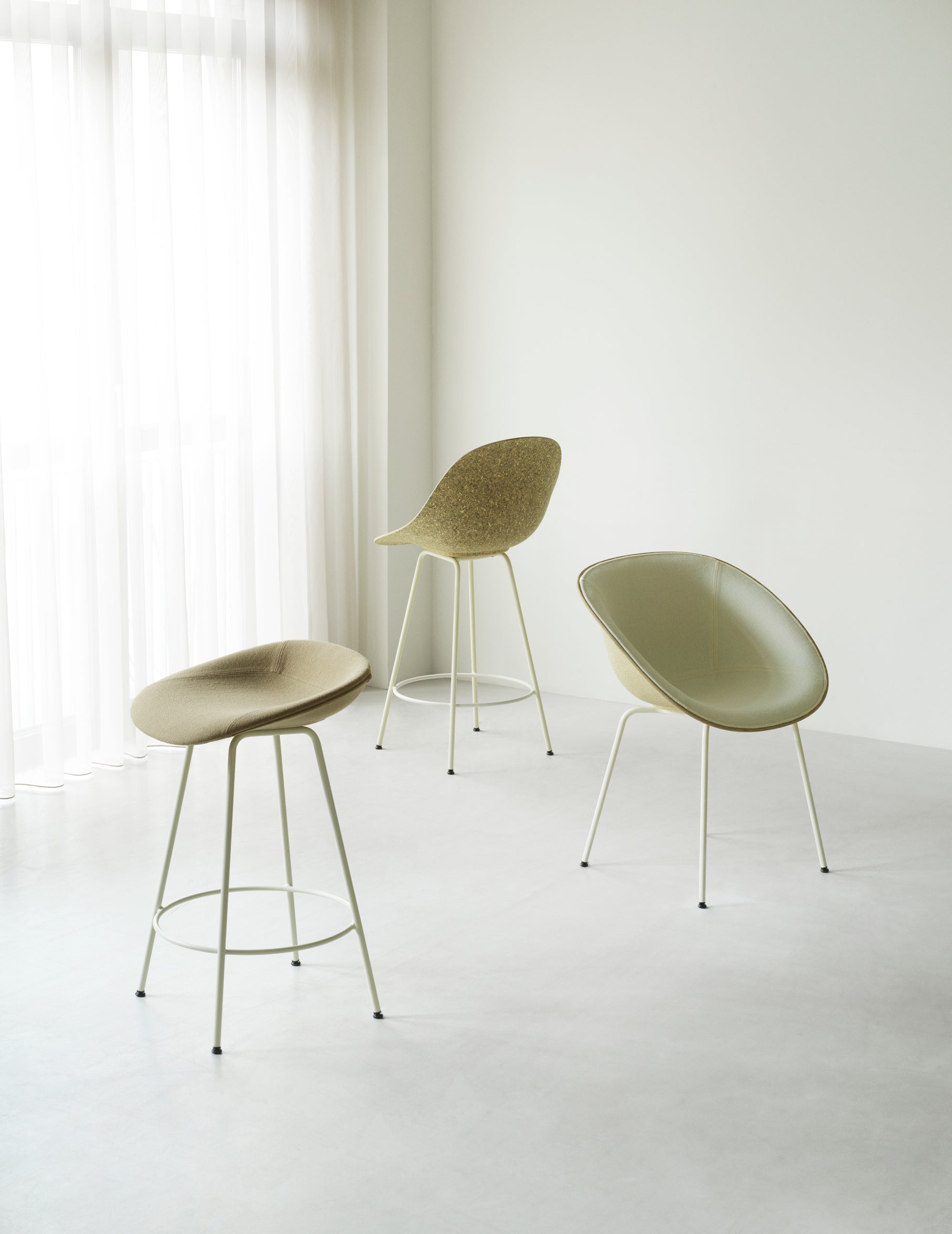 Armchair green upholstered chair with a black base