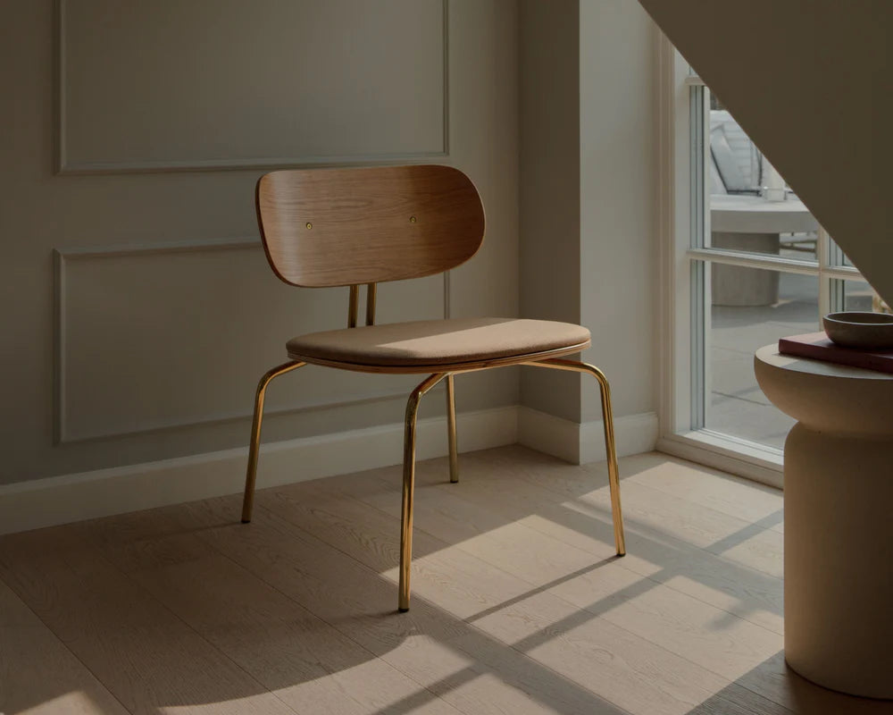 Beige curious armchair with a golden base