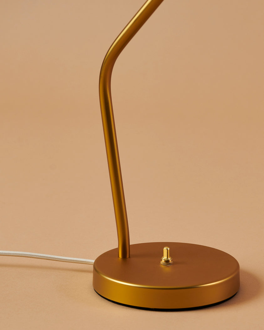 GRÄSHOPPA table lamp with a black glossy shade and a gold base