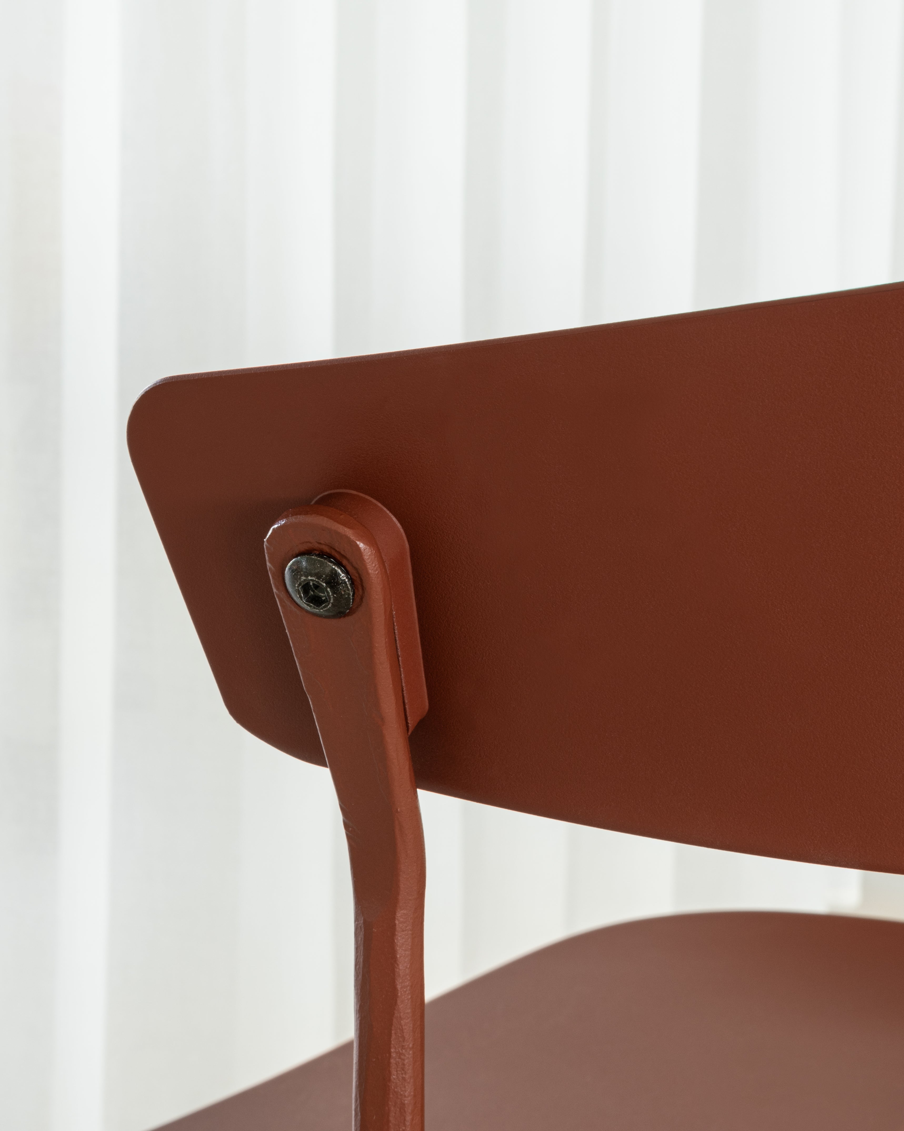 OFFICINA chair with a brown base and brown seat