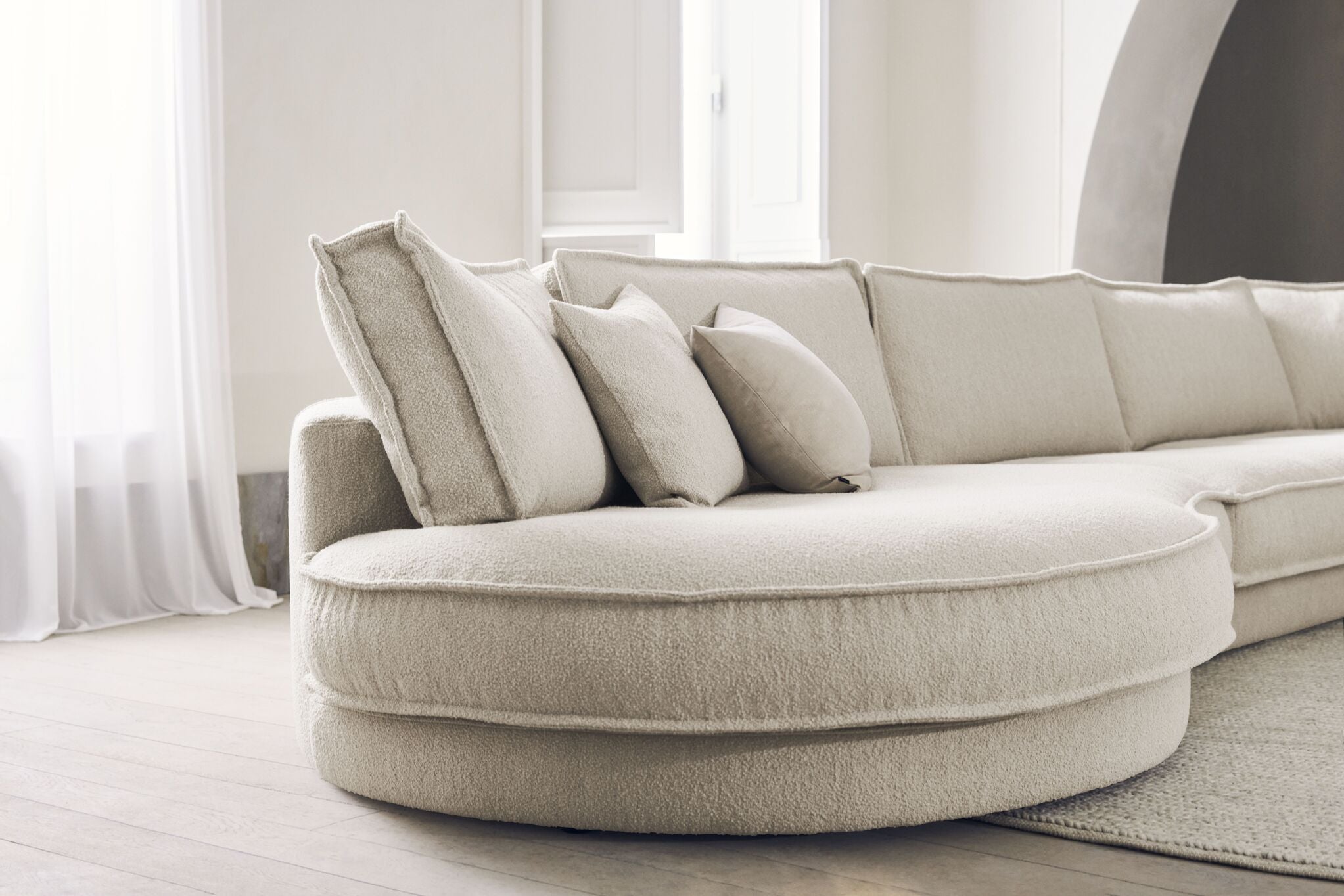 Sofa modułowa NOORA - zaokrąglony moduł lewostronny z czarną podstawą