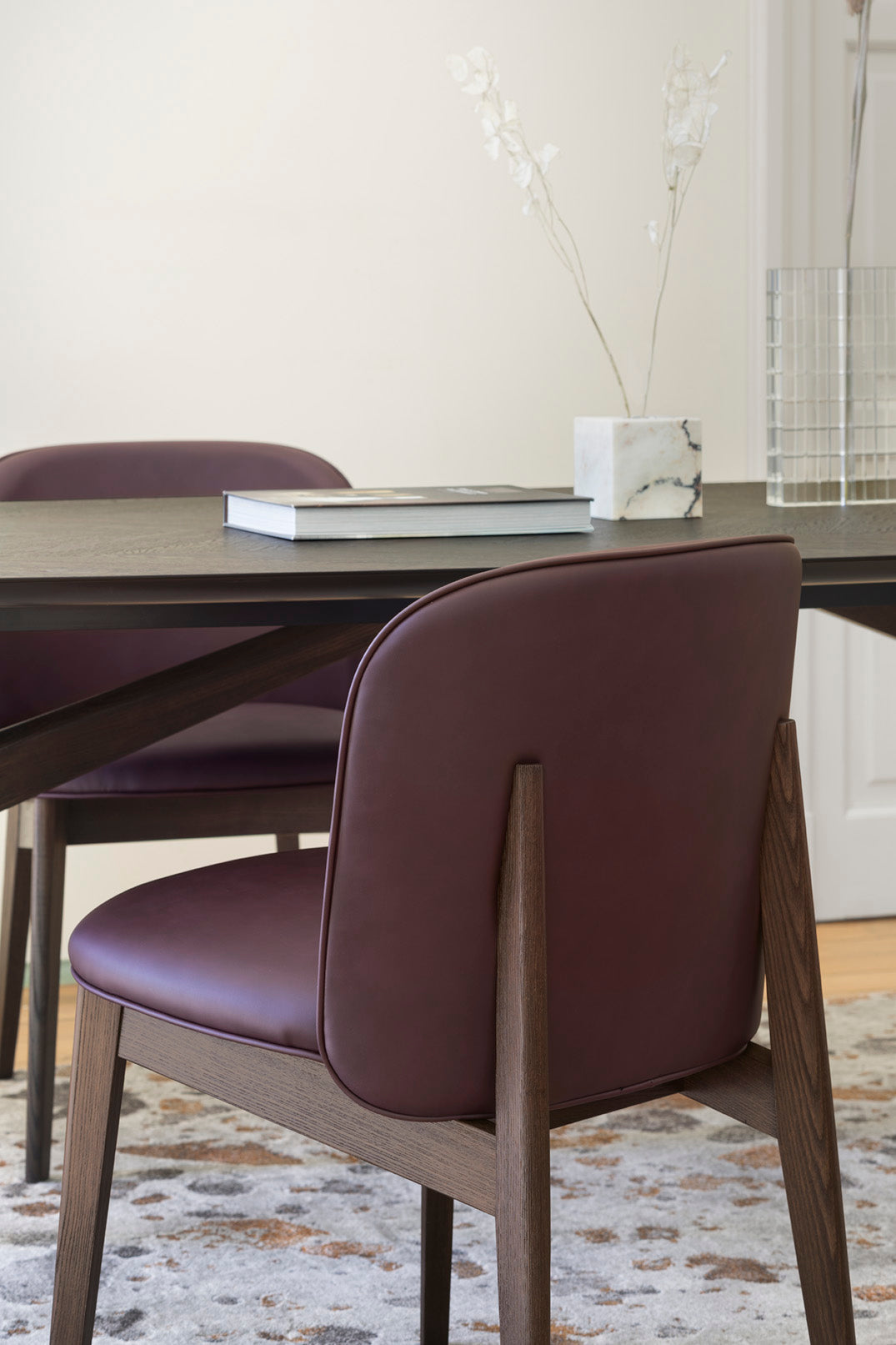 ABREY upholstered chair with a dark wooden base