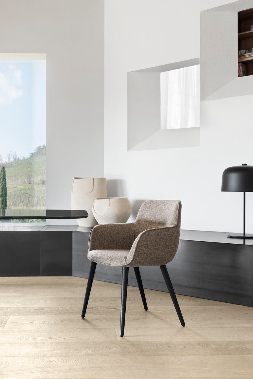 Cocoon upholstered chair with black metal base