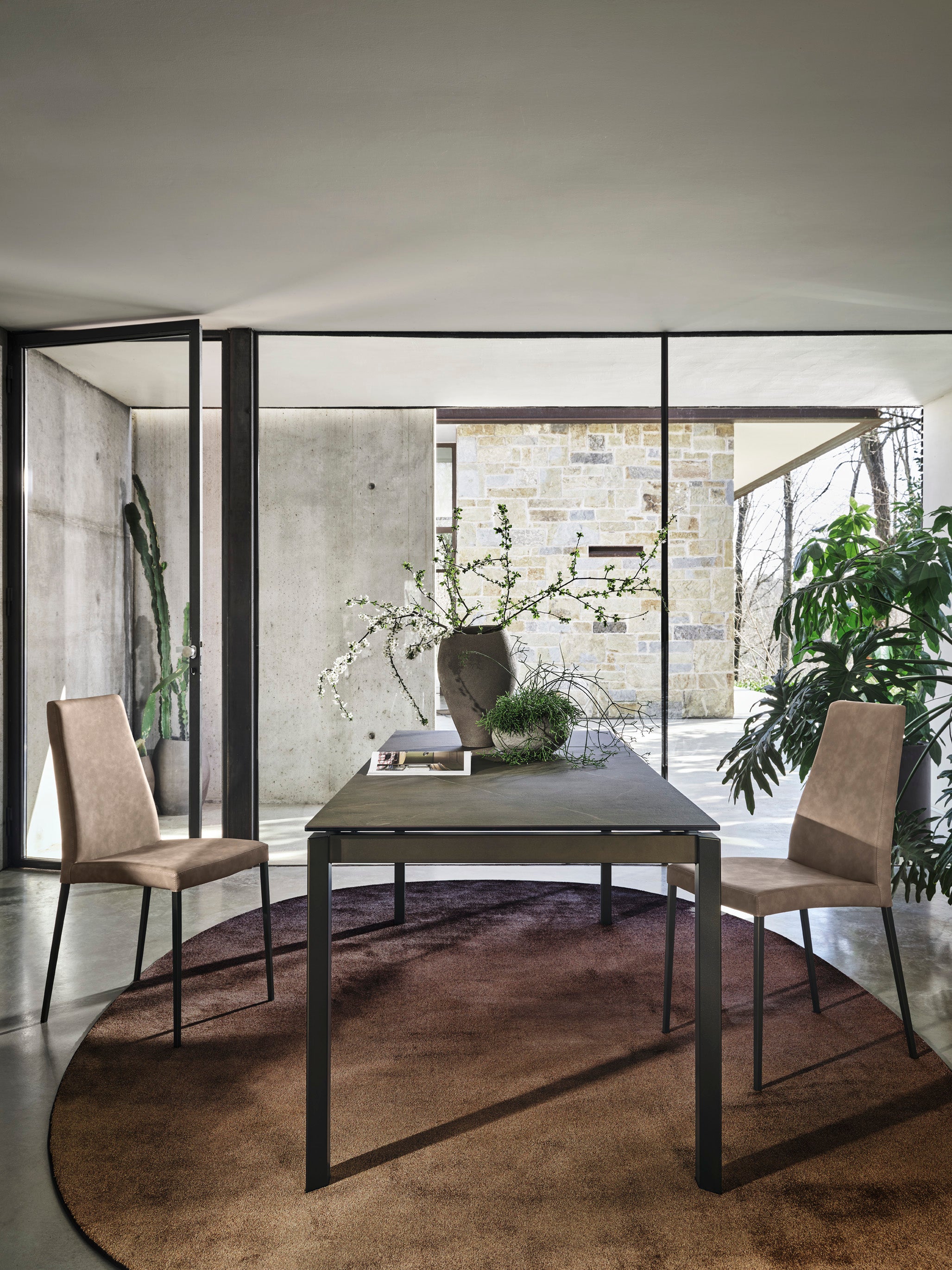 AIDA upholstered chair with a black base