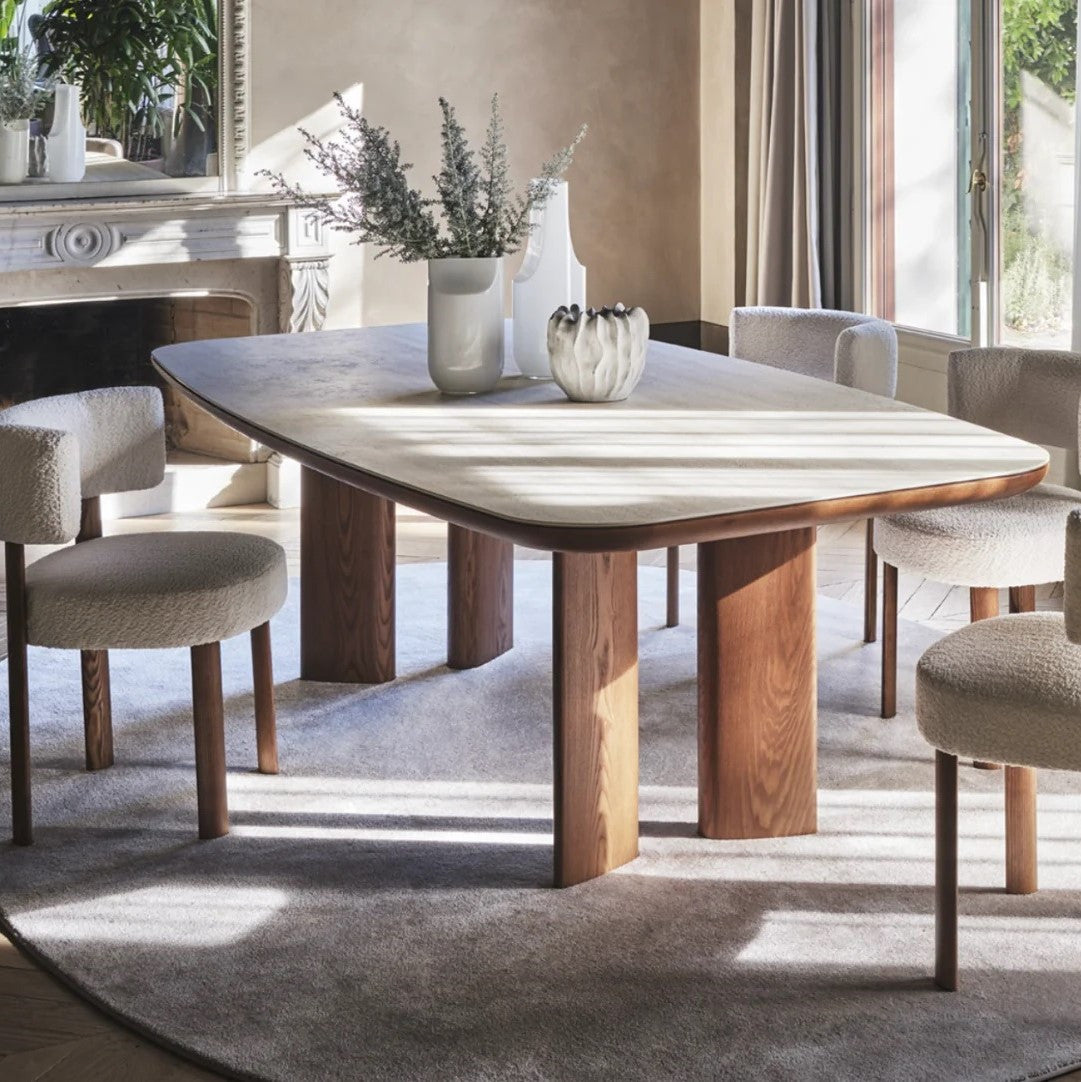 SANDY table with a ceramic top mimicking travertine and a walnut base