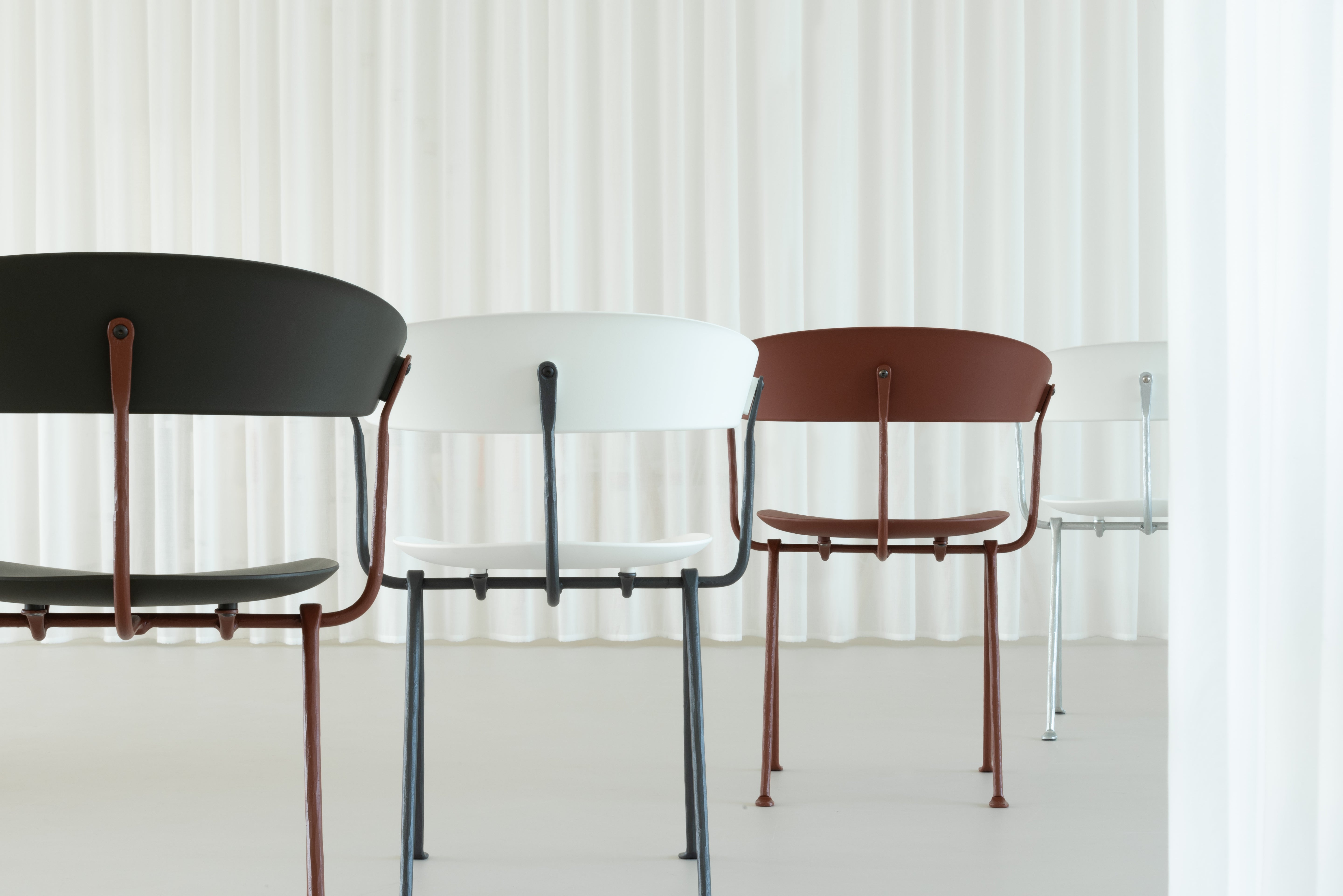 OFFICINA chair with a brown base and brown seat