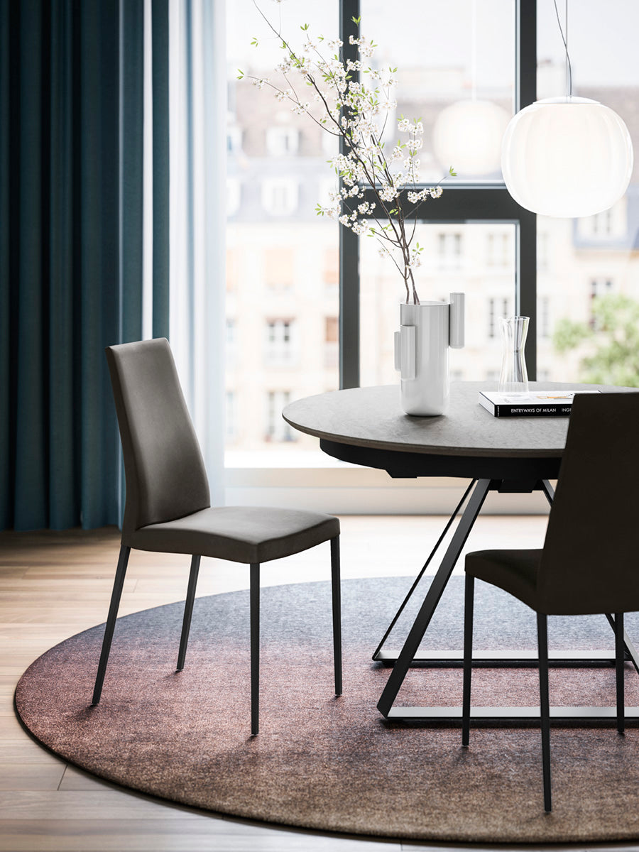 AIDA upholstered chair with a black base