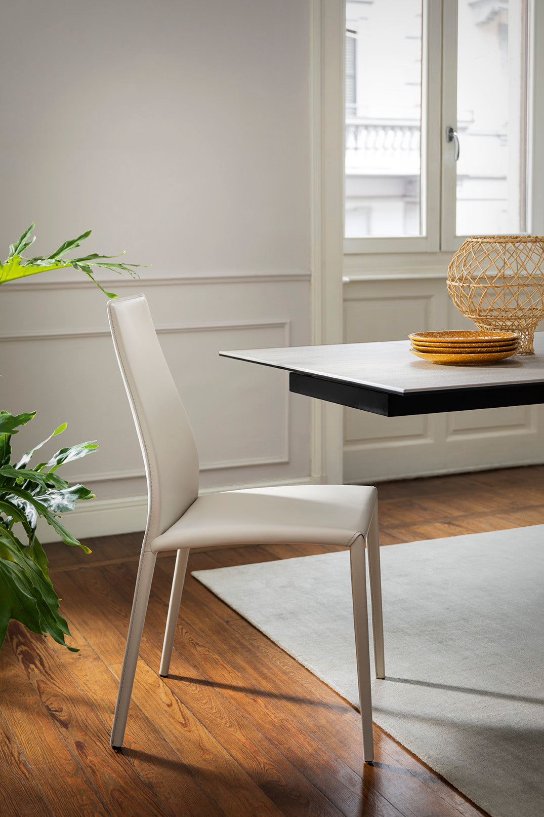 AIDA upholstered chair with a black base