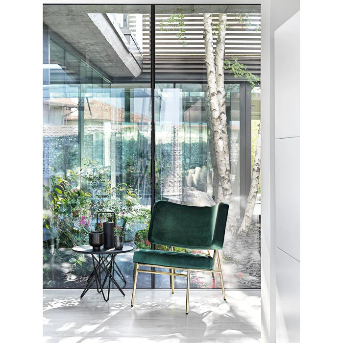 Upholstered COCO armchair with a black base