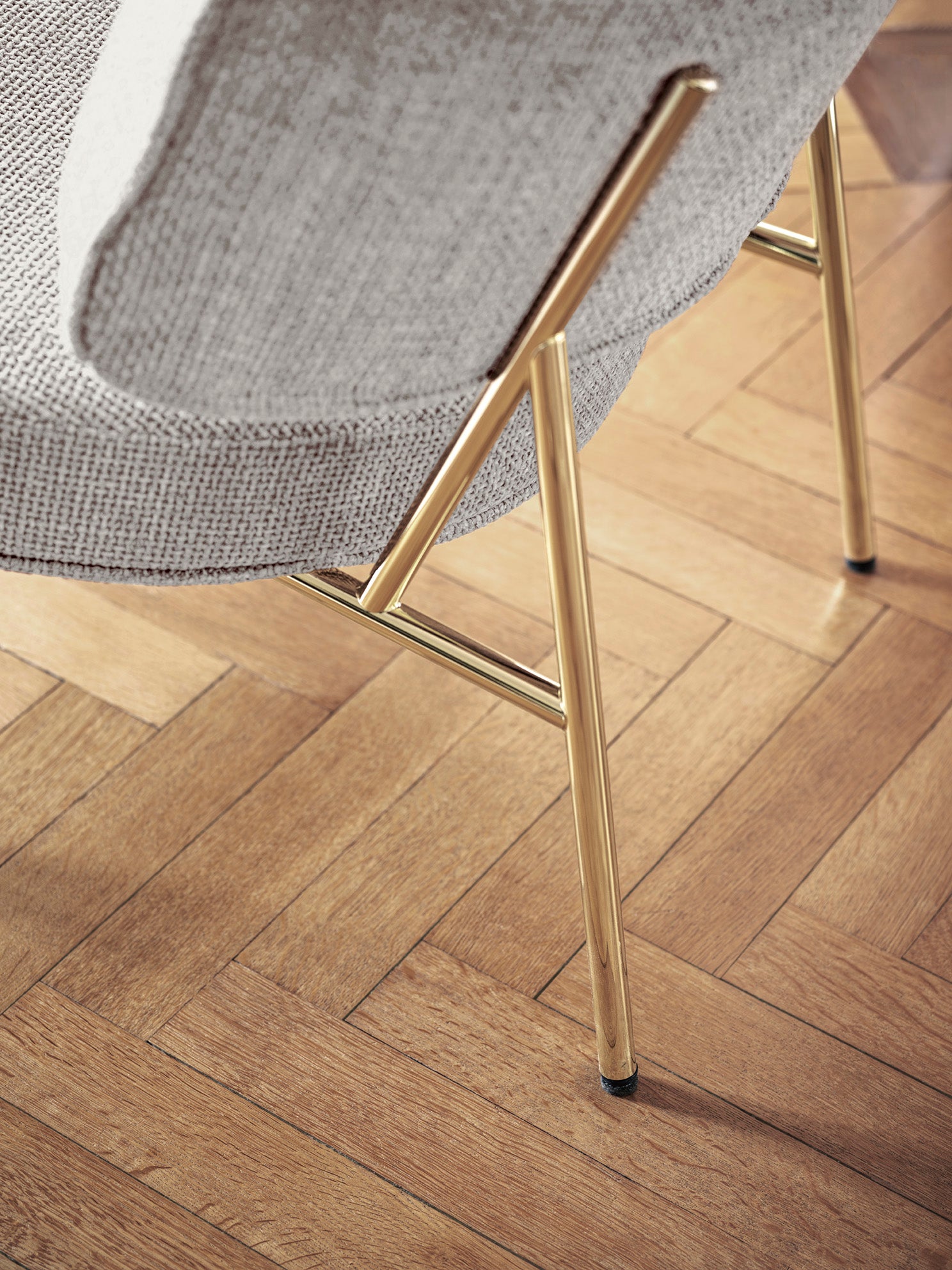 Upholstered COCO armchair with a black base