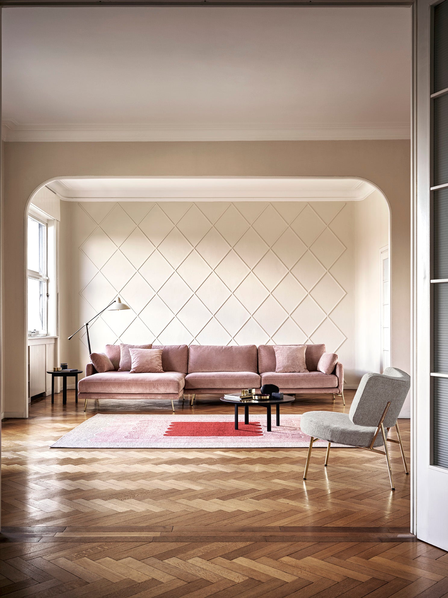 Upholstered COCO armchair with a golden base