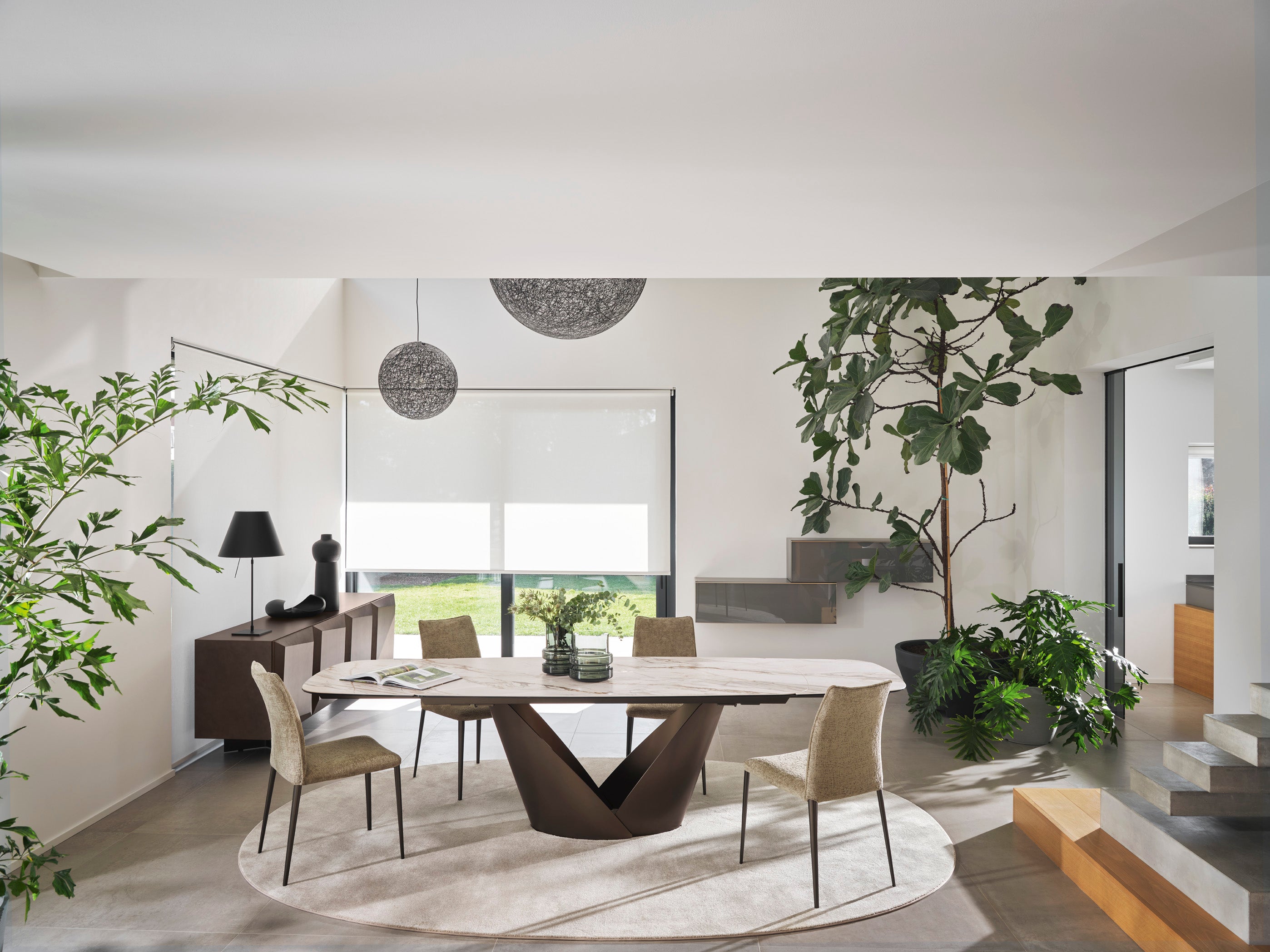 Expandable table CALLA with a white ceramic top and a brown base